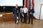 Gruppenbild Frau Iris Spranger, Herr Karsten Göwecke und zwei Angehörige der Berliner Feuerwehr