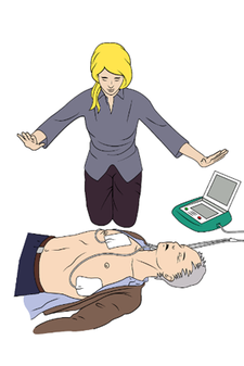 Eine Frau hat einen Defibrillator mit einer Person verbunden